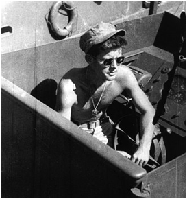 Description: https://upload.wikimedia.org/wikipedia/commons/thumb/8/85/Lt._John_F._Kennedy_aboard_the_PT-109.jpg/330px-Lt._John_F._Kennedy_aboard_the_PT-109.jpg