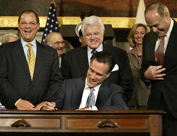 Description: Mitt signs bill