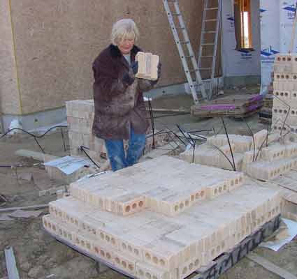 Al's wife stacking bricks