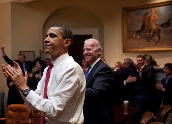...and whose picture is on the wall behind President Obama as they celebrate the passage of the healthcare bill?