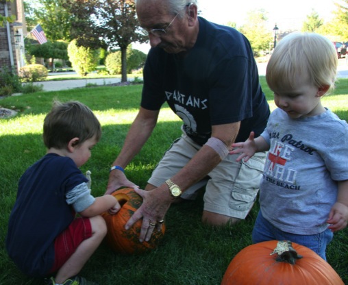 Owen helping Jack and Al with the pumpkins