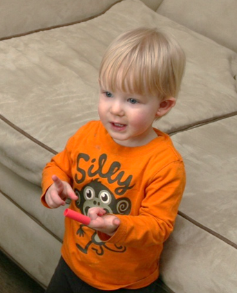 Owen playing with a marker