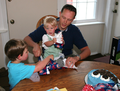 Finally, the fun begins helping Daddy unwrap his gifts.