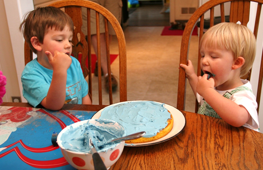 Owen is in heaven with the blue icing.