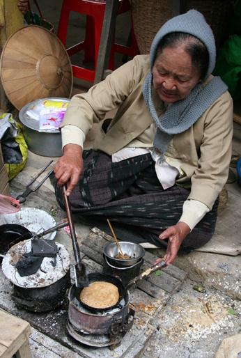 Burmese woman cooking