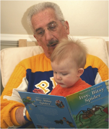 Description: Al reading to Owen