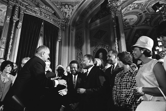 President Johnson, Martin Luther King, Jr., and Rosa Parks at the signing of the Voting Rights Act on August 6, 1965.