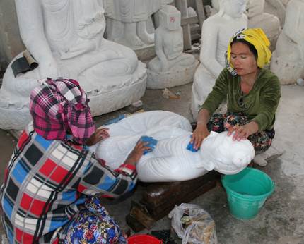 Women working on statues