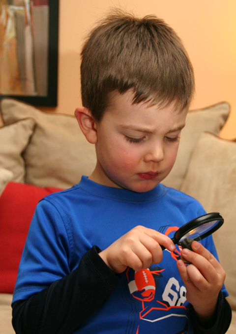 Jack using a magnifying glass