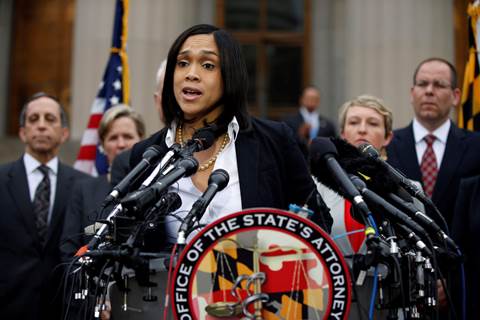 Marilyn Mosby, Baltimore state's attorney, announces criminal charges Friday against all six officers suspended after Freddie Gray suffered a fatal spinal injury while in police custody.  (Alex Brandon/AP)